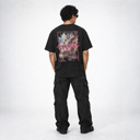 Back view of the Sinners Oversize T-Shirt in black, worn with cargo pants, showing the painted PEOPLE back print